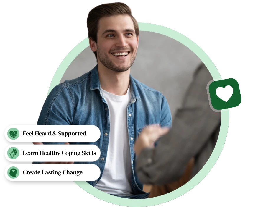 Smiling man talking during a mental wellness montclair adult therapy session surrounded by wellness badges.