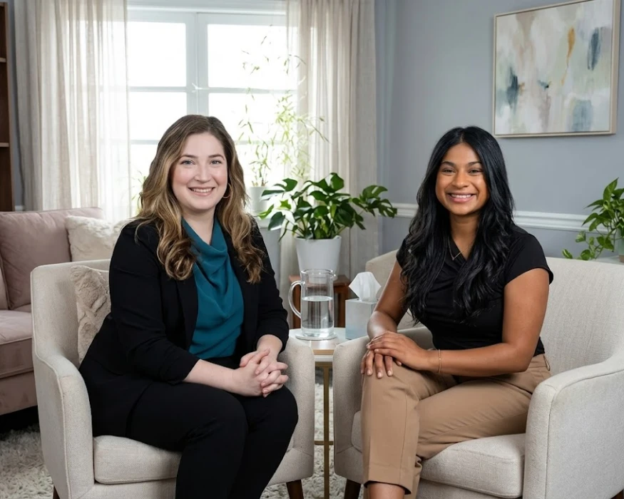 Two smiling female therapists sitting in an office, showcasing mental wellness montclair Career team opportunities.