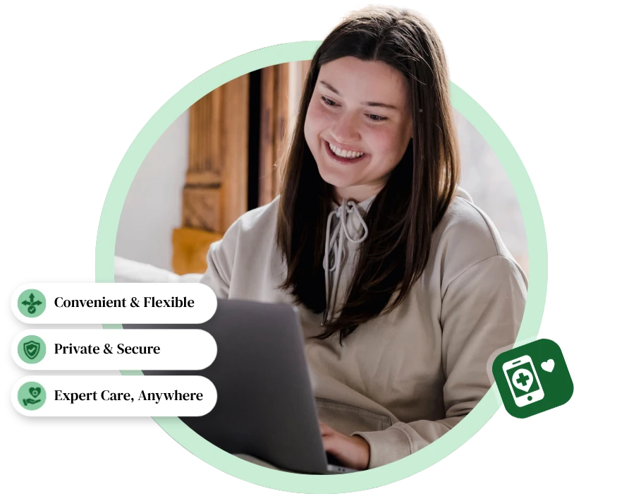 A smiling woman using a laptop during a Mental Wellness Montclair virtual therapy session with care feature badges.
